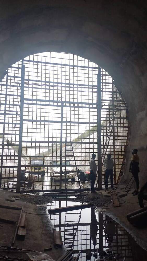 Tunnel mouth with steel mesh gate installed